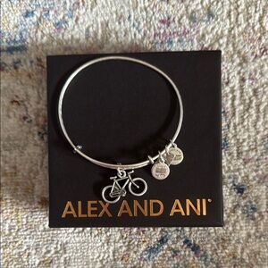 Alex and Ani bicycle charm bangle bracelet in silver.
